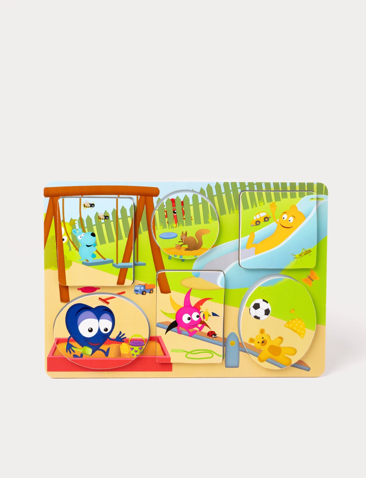  Image of A wooden puzzle featuring Babblarna characters playing in a colorful outdoor playground scene.