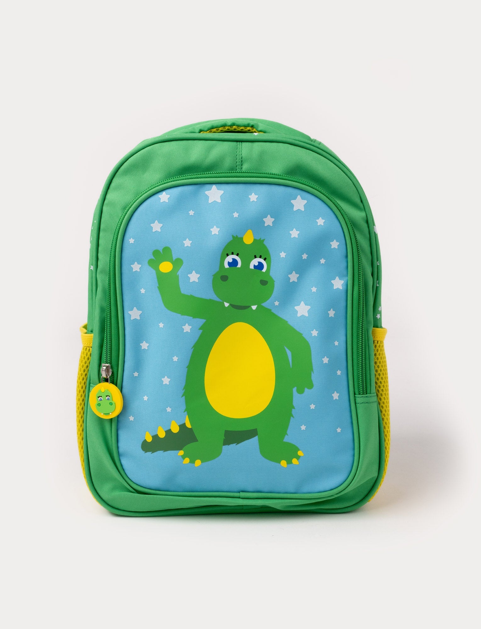  Image of A green children's backpack featuring the Bolibompa dragon on a blue starry background, with yellow side pockets.