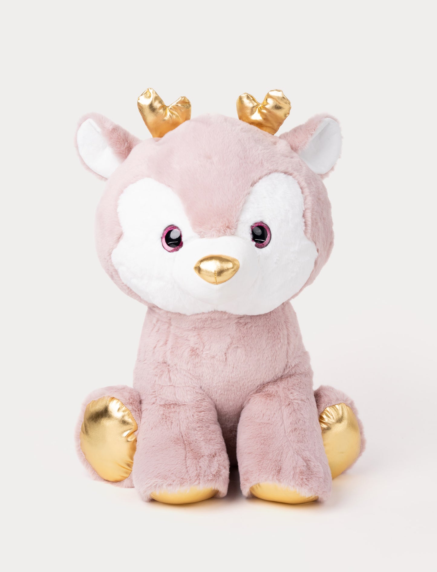 Soft pink plush deer with white accents, golden antlers, a gold nose, and shimmering gold hooves.