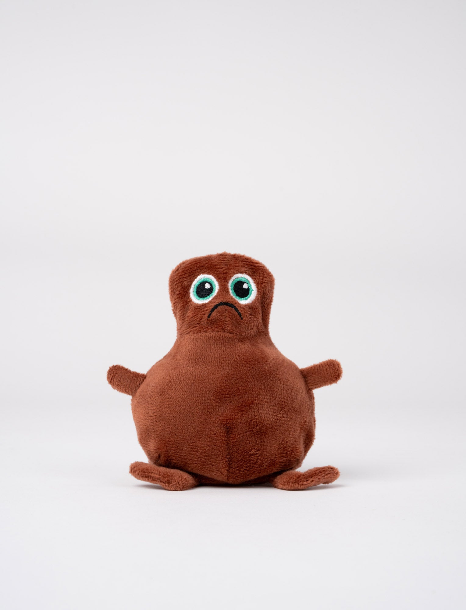  Image of Reversible Babblarna Dadda plush toy in brown with a sad, frowning face.