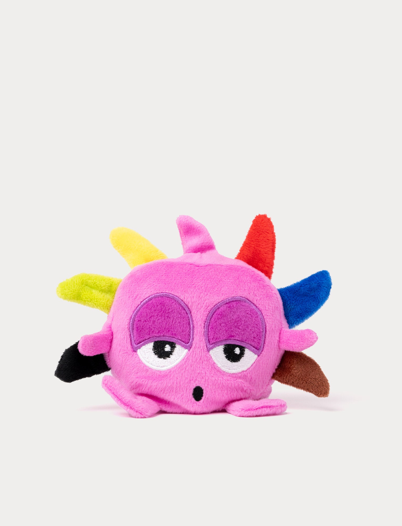  Image of Reversible Babblarna Diddi plush toy with rainbow spikes and a tired face.