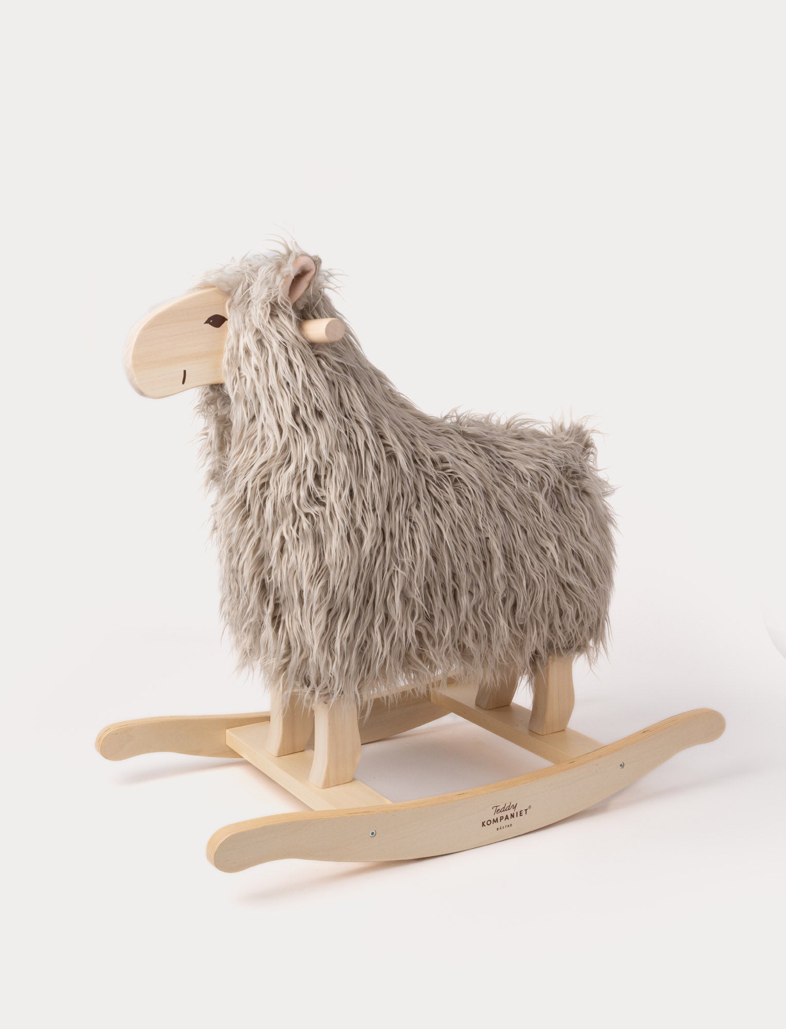  Image of Rocking sheep with grey fur, a wooden face, and a sturdy wooden base.