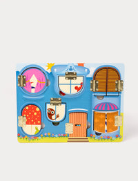Colorful wooden activity board with small doors hiding playful Babblarna characters.