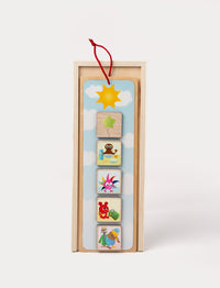 Babblarna wooden activity calendar with colorful character tiles and day-and-night theme.
