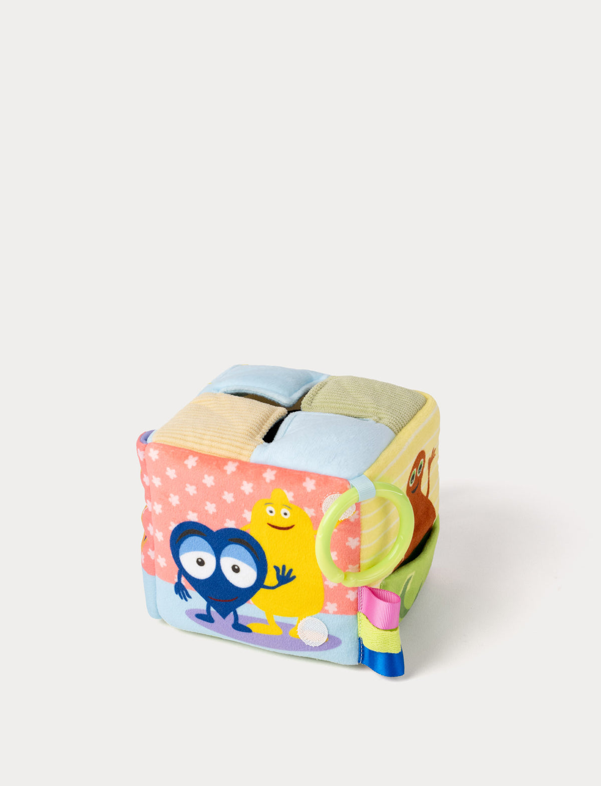  Image of A colorful baby sensory cube toy with Babblarna, with soft fabric panels and a green ring handle.