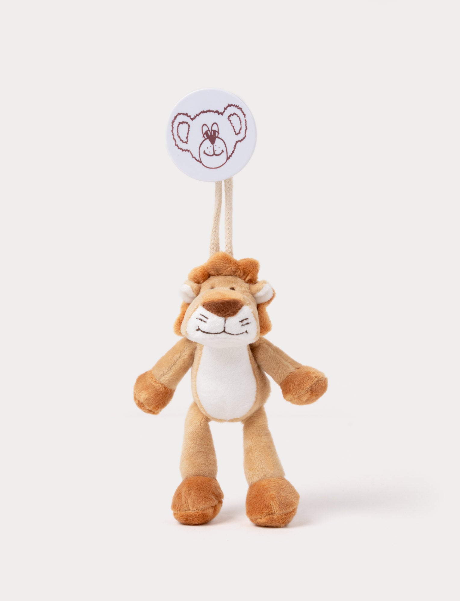  Image of A plush lion clip toy with a soft mane, white belly, and a round bear-illustrated clip