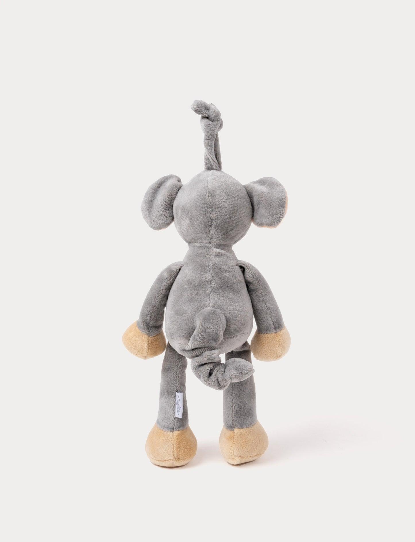 A plush elephant music box with large ears, a white belly, beige feet, and a fabric loop for hanging.