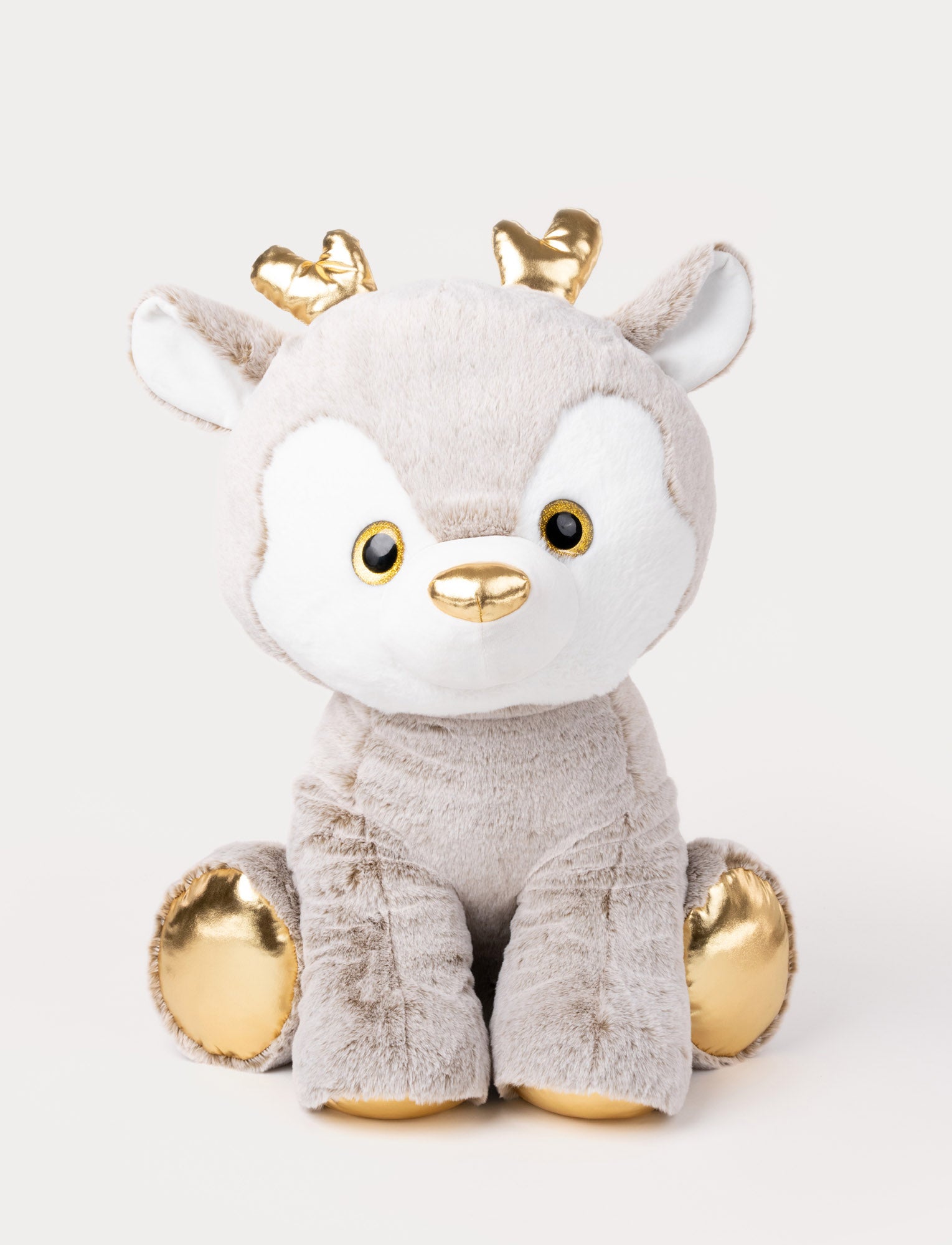  Image of Soft plush reindeer toy in light brown with shiny golden antlers, nose, and hooves