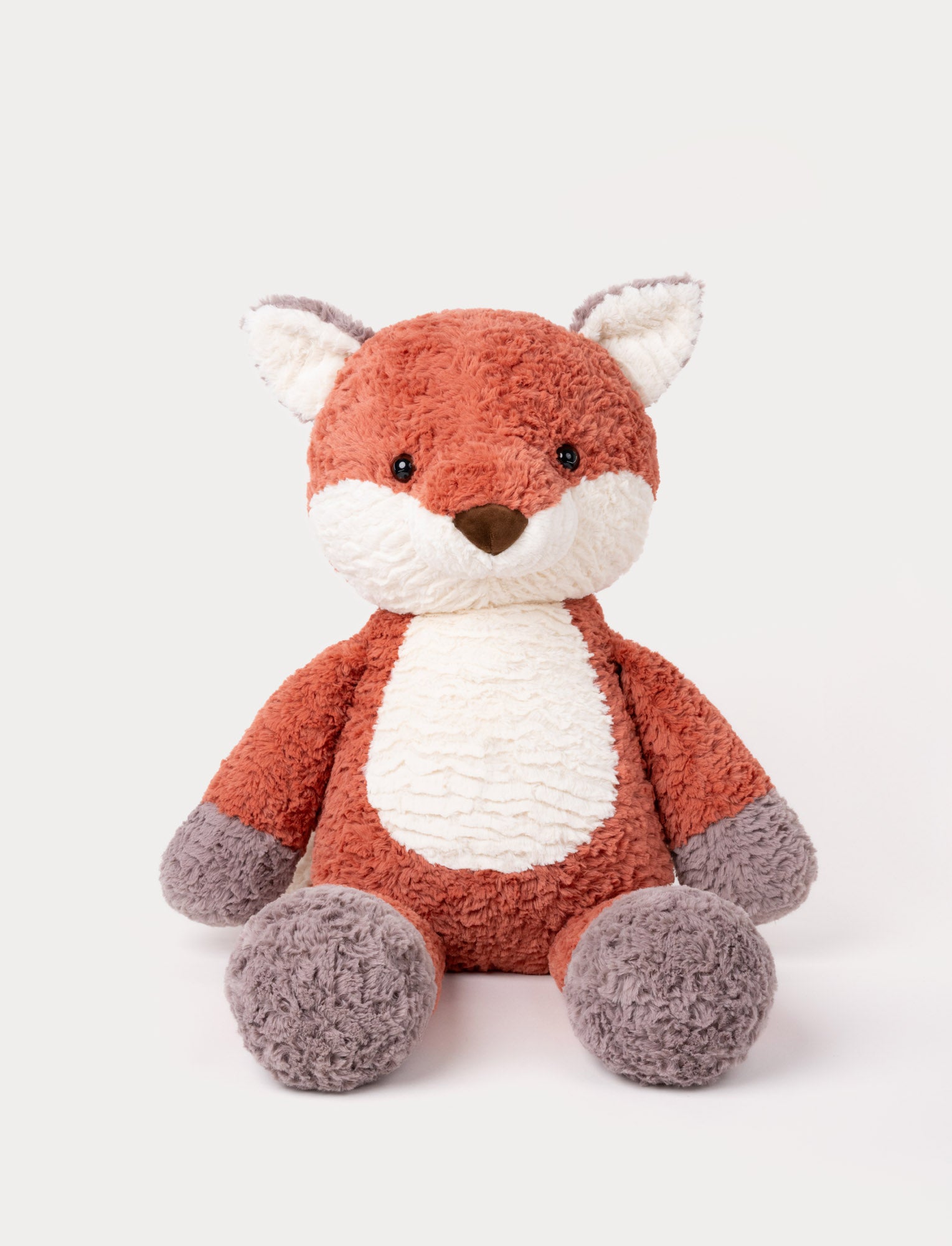  Image of Soft plush fox toy with orange fur, white belly and face, and gray paws and ear tips
