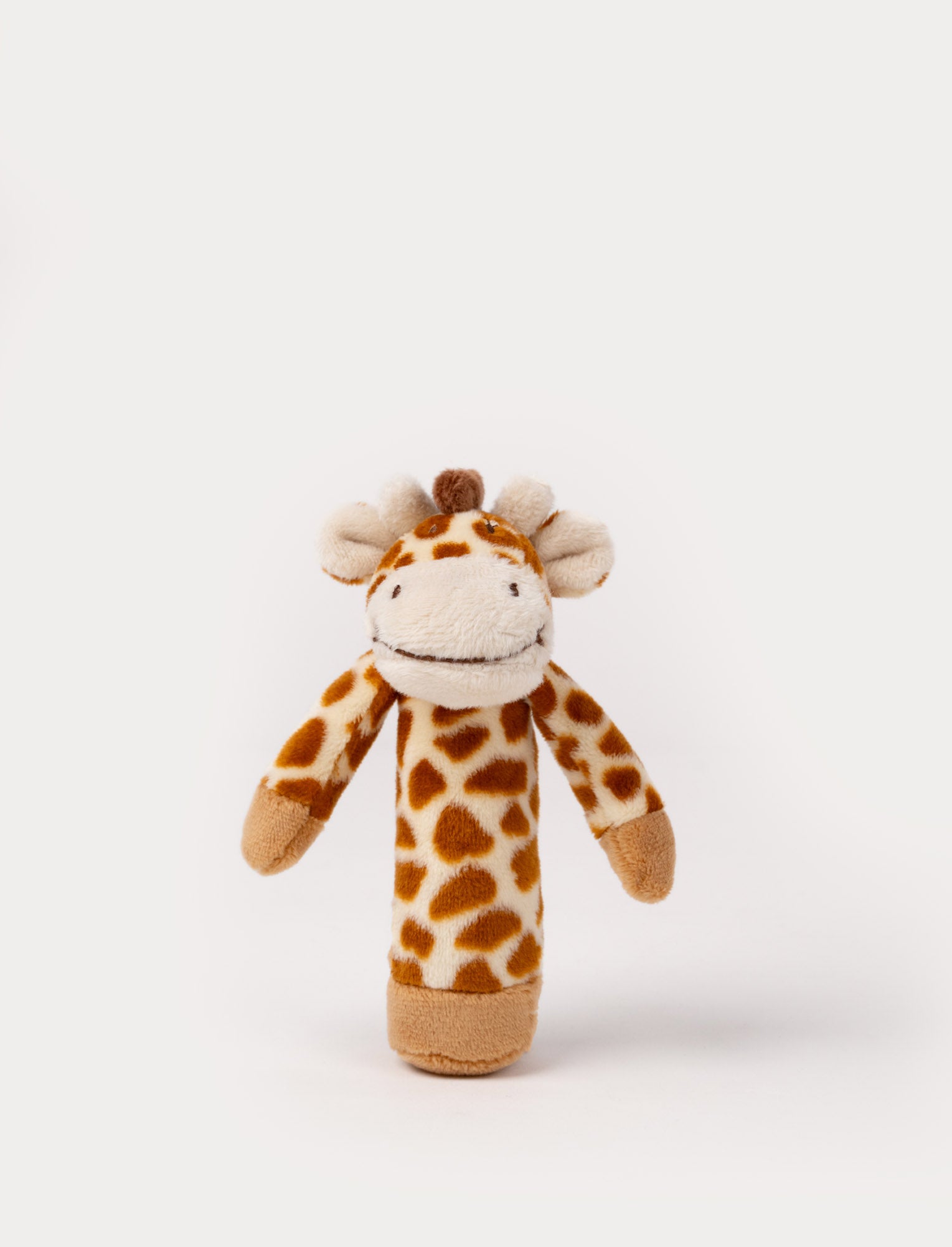  Image of A white and brown giraffe-shaped rattle with an easy-to-grip design and gentle rattling sound.