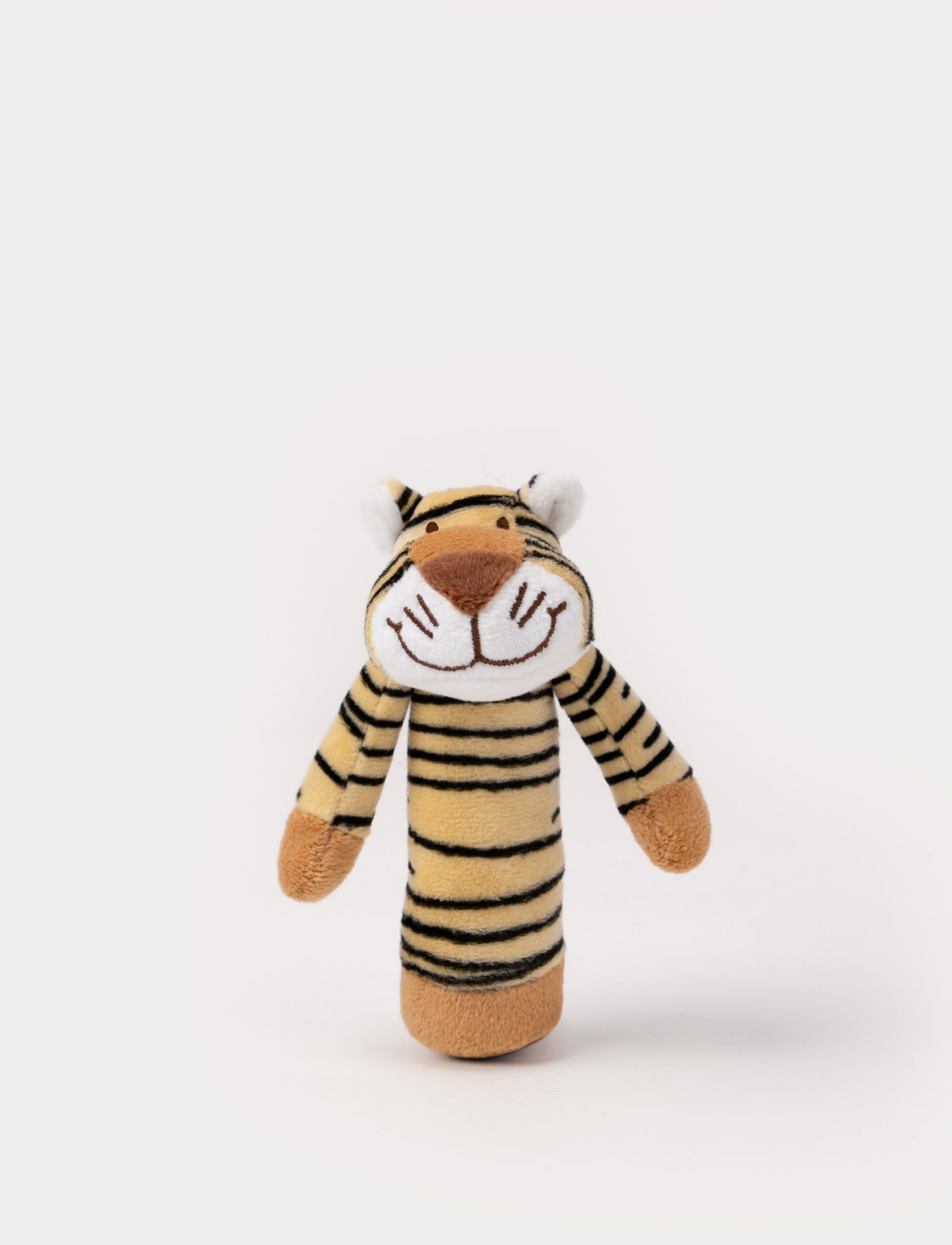 A soft tiger-shaped rattle in beige with black stripes