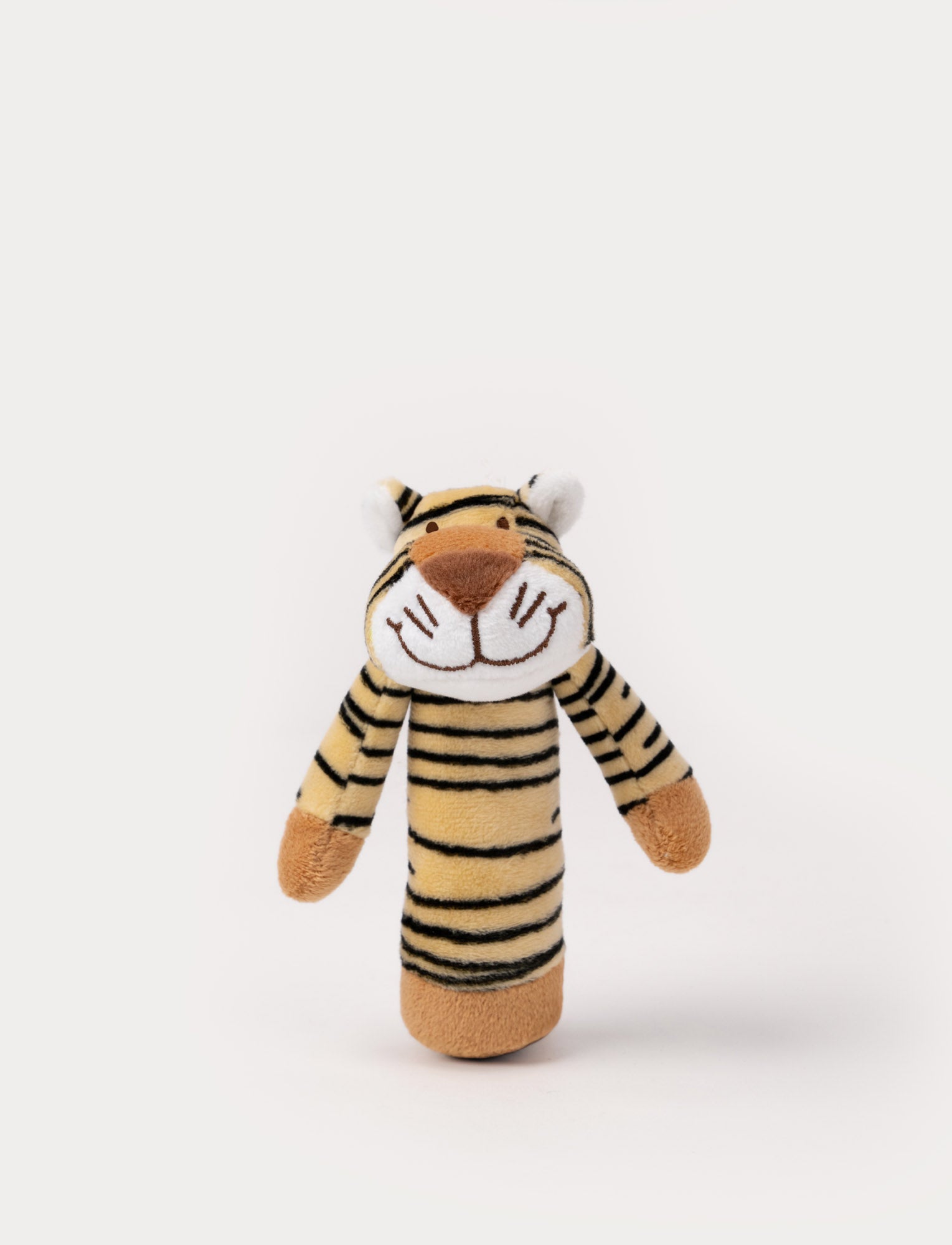  Image of A soft tiger-shaped rattle in beige with black stripes