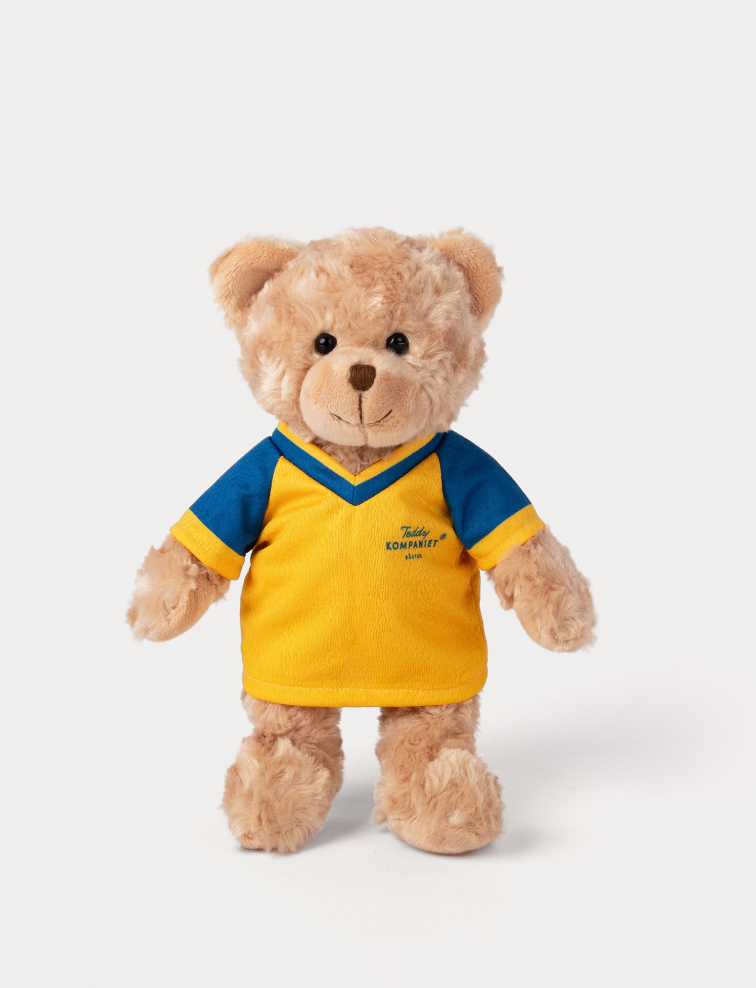  Image of Stuffed teddy bear toy wearing a yellow and blue football shirt 