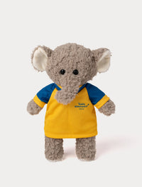 Stuffed elephant toy wearing a yellow and blue football shirt 