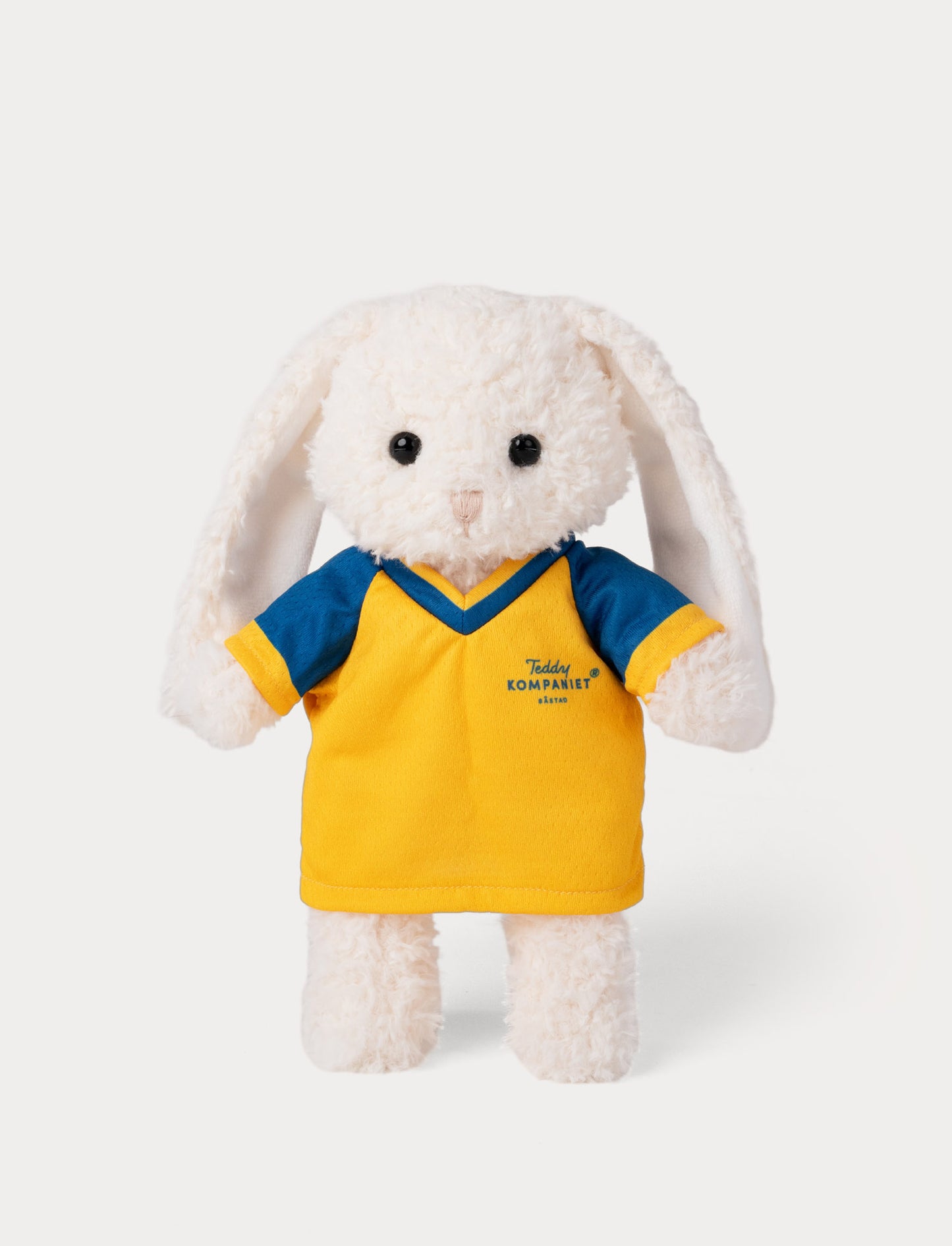 Stuffed bunny toy wearing a yellow and blue football shirt 