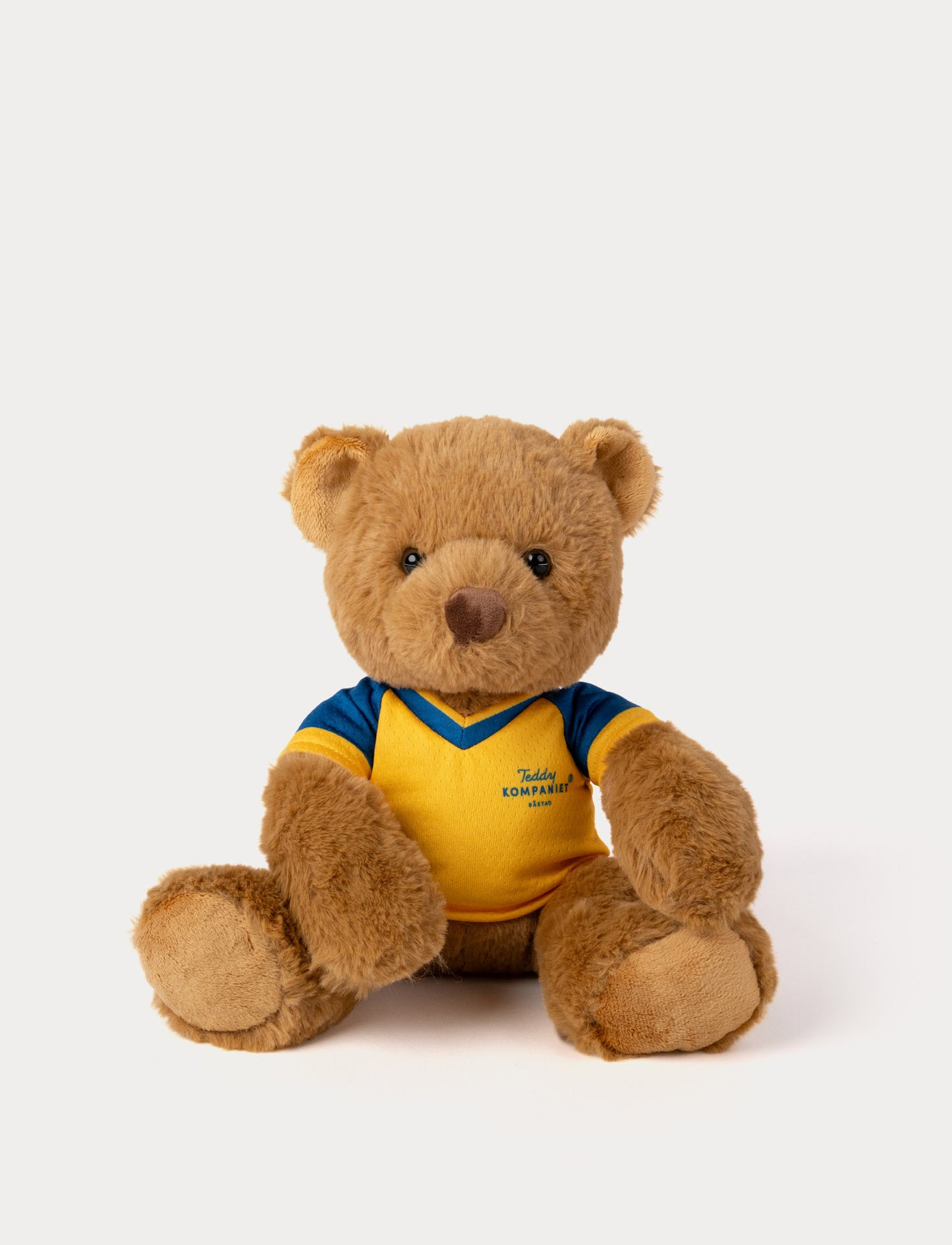 Stuffed teddy bear toy wearing a yellow and blue football shirt 