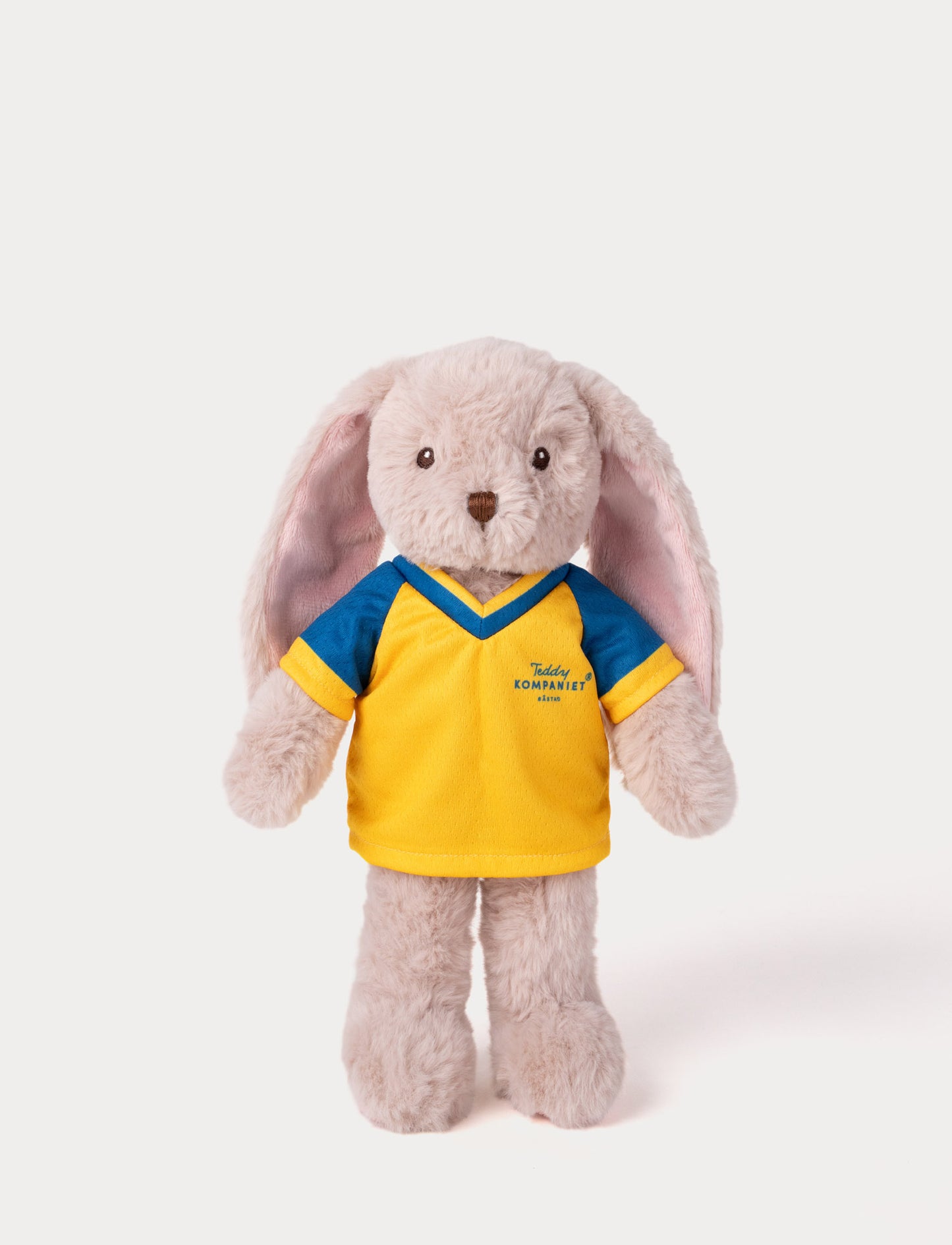 Stuffed bunny toy wearing a yellow and blue football shirt 