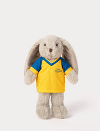 Stuffed bunny toy wearing a yellow and blue football shirt 
