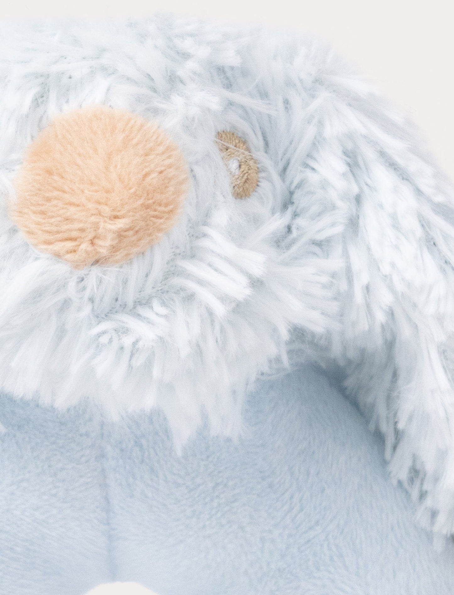 Soft blue baby rattle with a plush bunny head and floppy furry ears.
