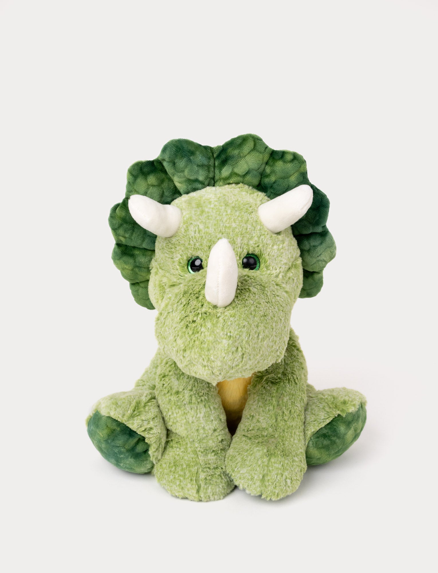  Image of Soft green plush triceratops with three white horns and green shiny eyes.