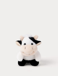 Small Plush cow toy on a white background