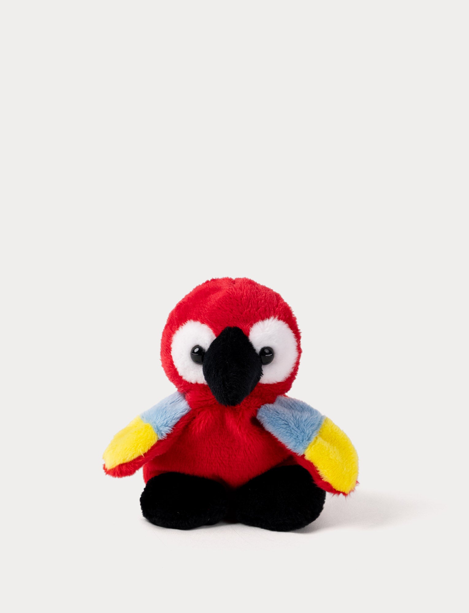  Image of Plush parrot toy with red head, blue and yellow wings on a white background
