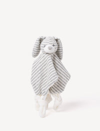A grey and white striped plush bunny comforter with floppy ears and knotted fabric ends.