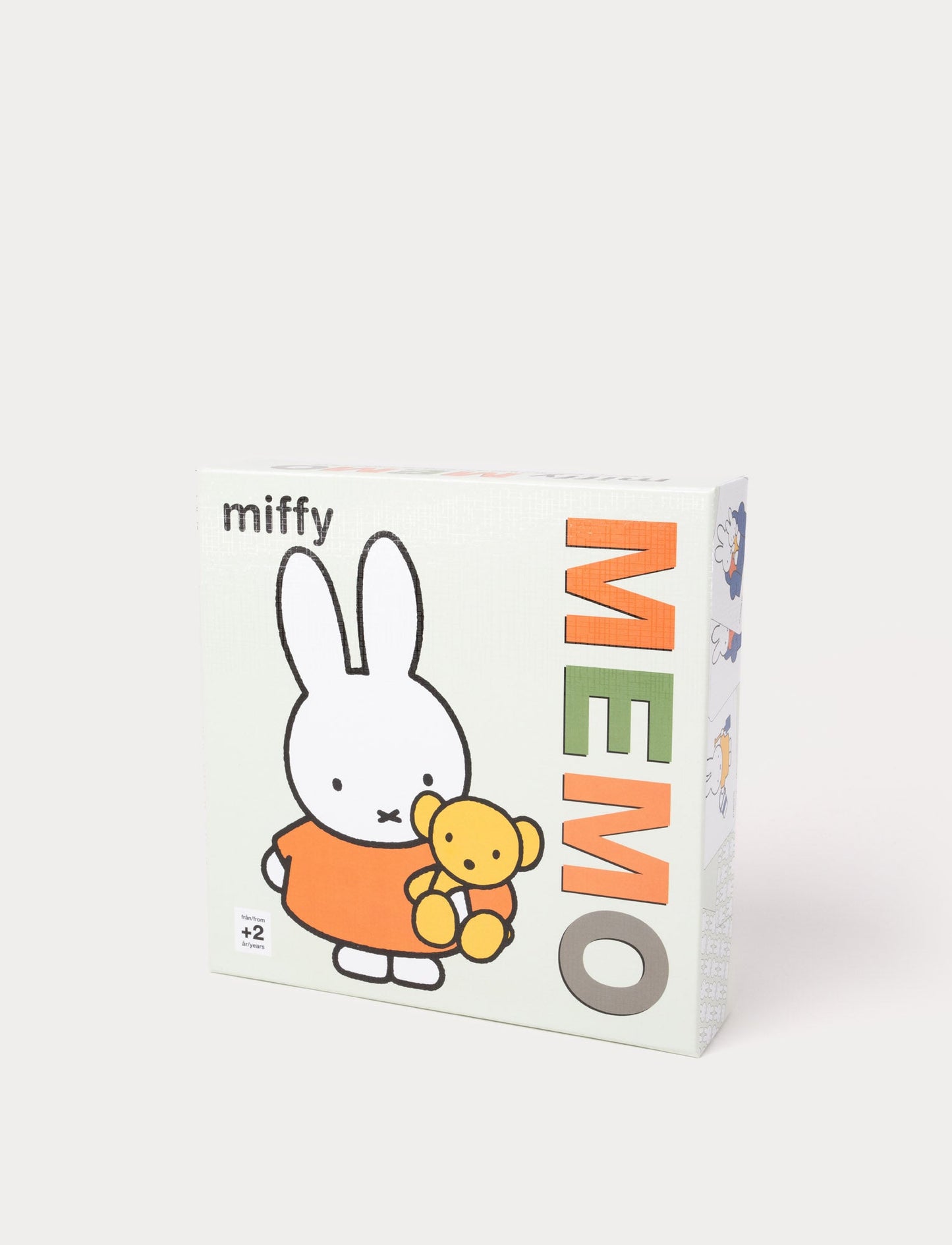 Miffy-themed memory game in a box, featuring the classic rabbit character holding a teddy bear.