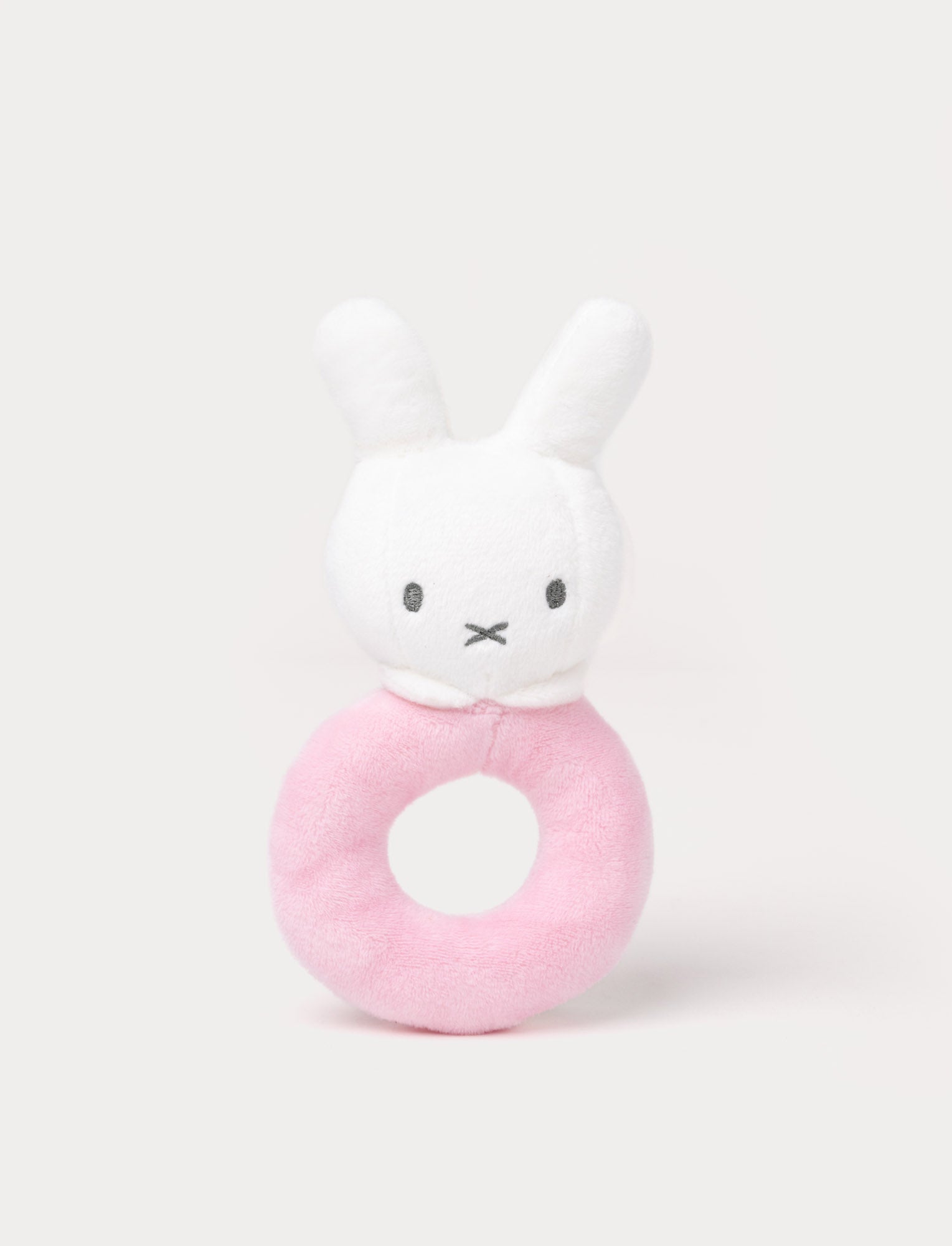 Image of Soft Miffy plush rattle with a white bunny head and a pink ring-shaped handle.