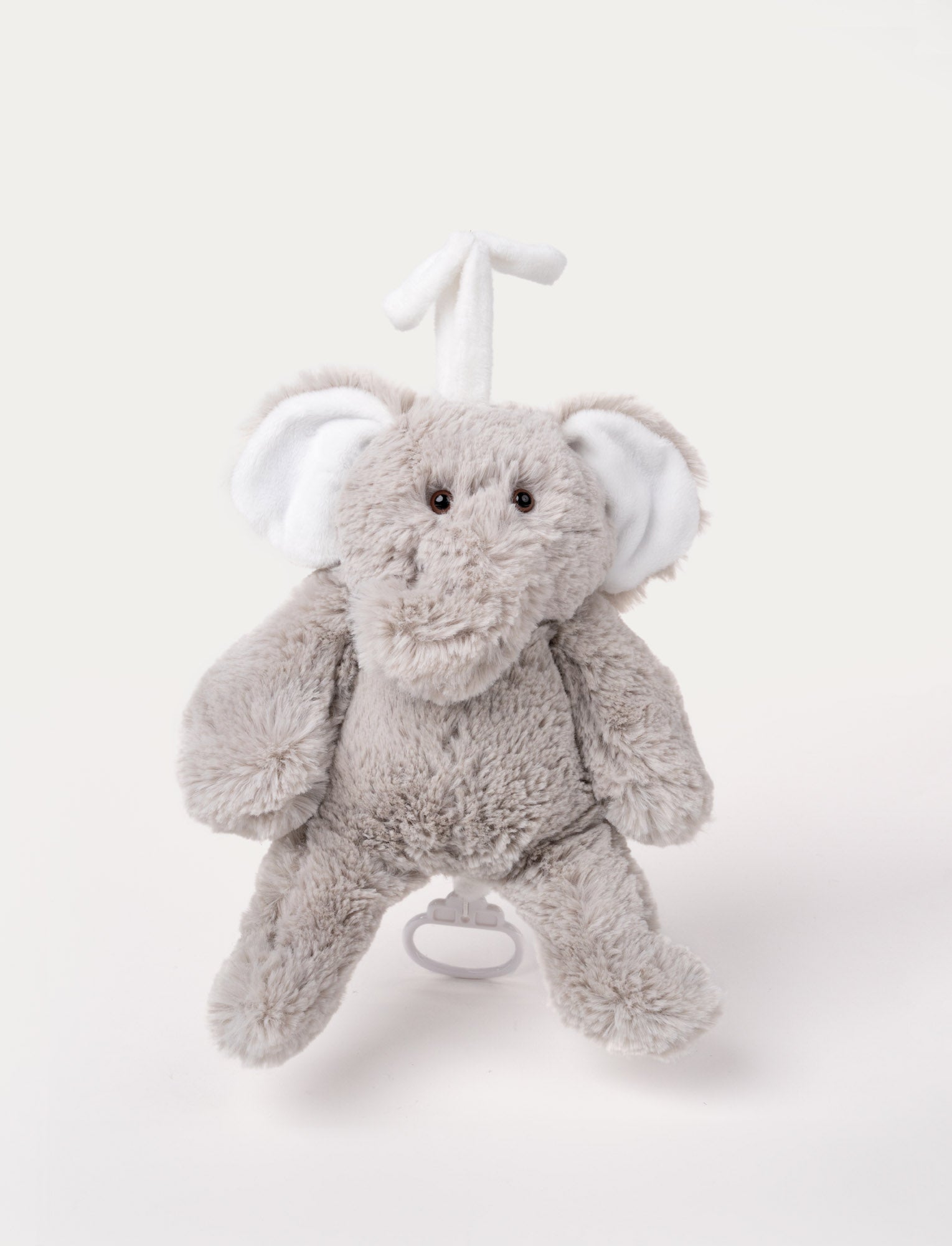  Image of Soft grey elephant plush with large ears and a pull-string music box attachment.