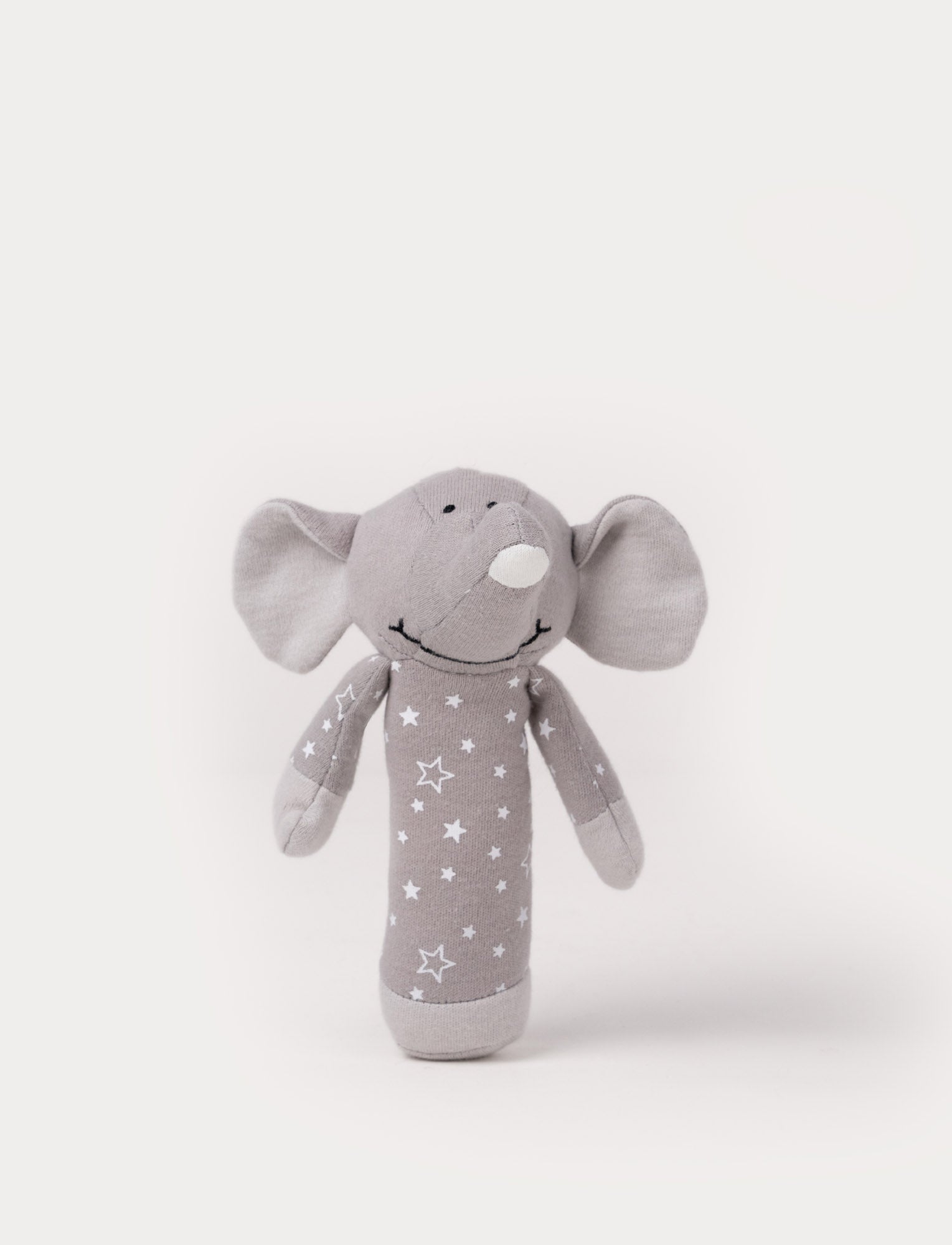  Image of Grey elephant rattle toy with a soft fabric body decorated with white stars.