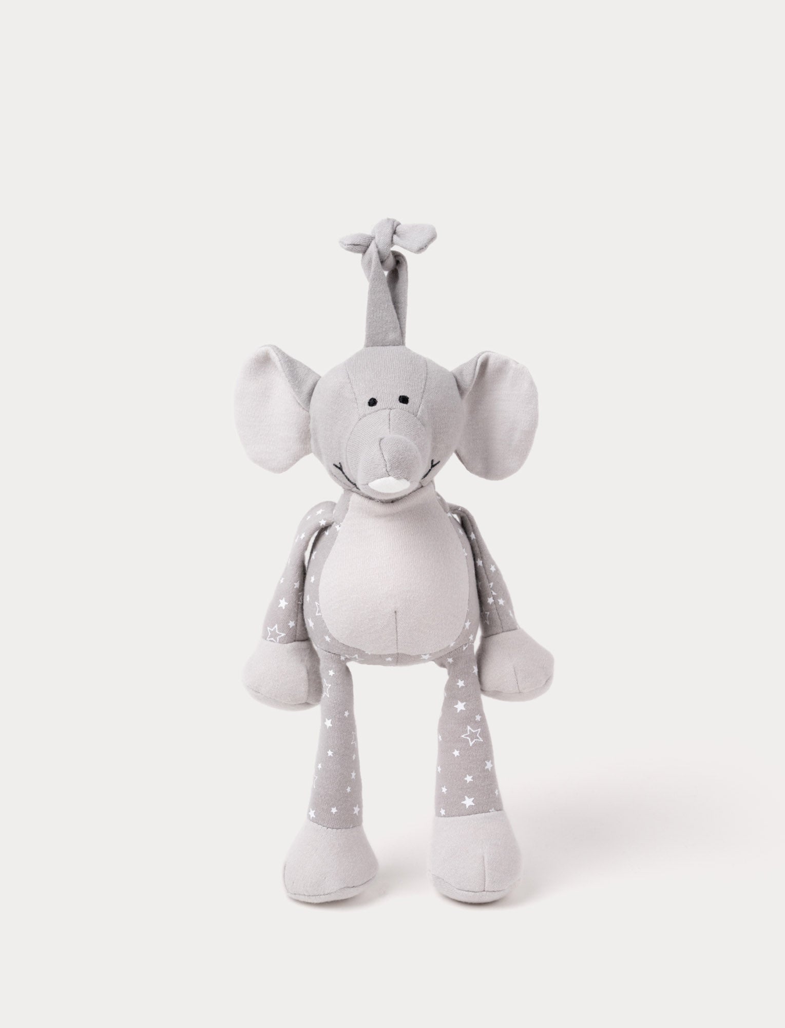  Image of A grey plush elephant music box with star-patterned limbs, large ears, and a fabric loop for hanging