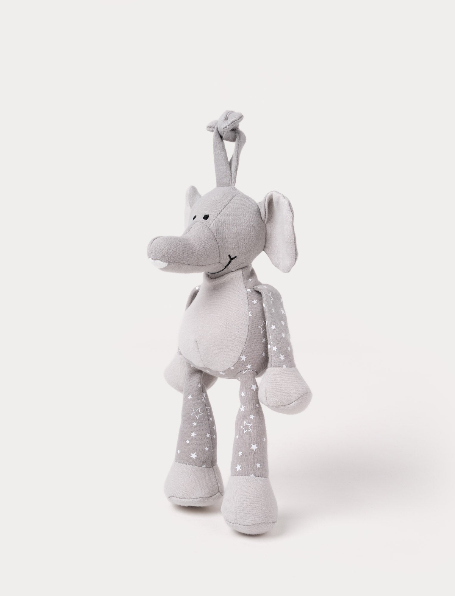  Image of A grey plush elephant music box with star-patterned limbs, large ears, and a fabric loop for hanging