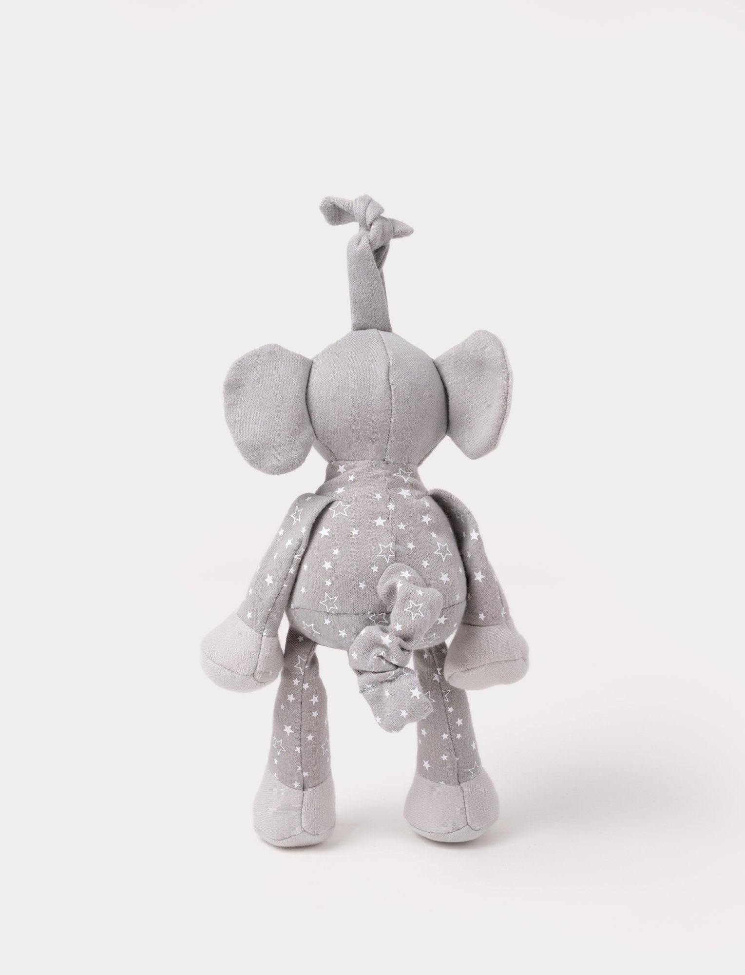  Image of A grey plush elephant music box with star-patterned limbs, large ears, and a fabric loop for hanging