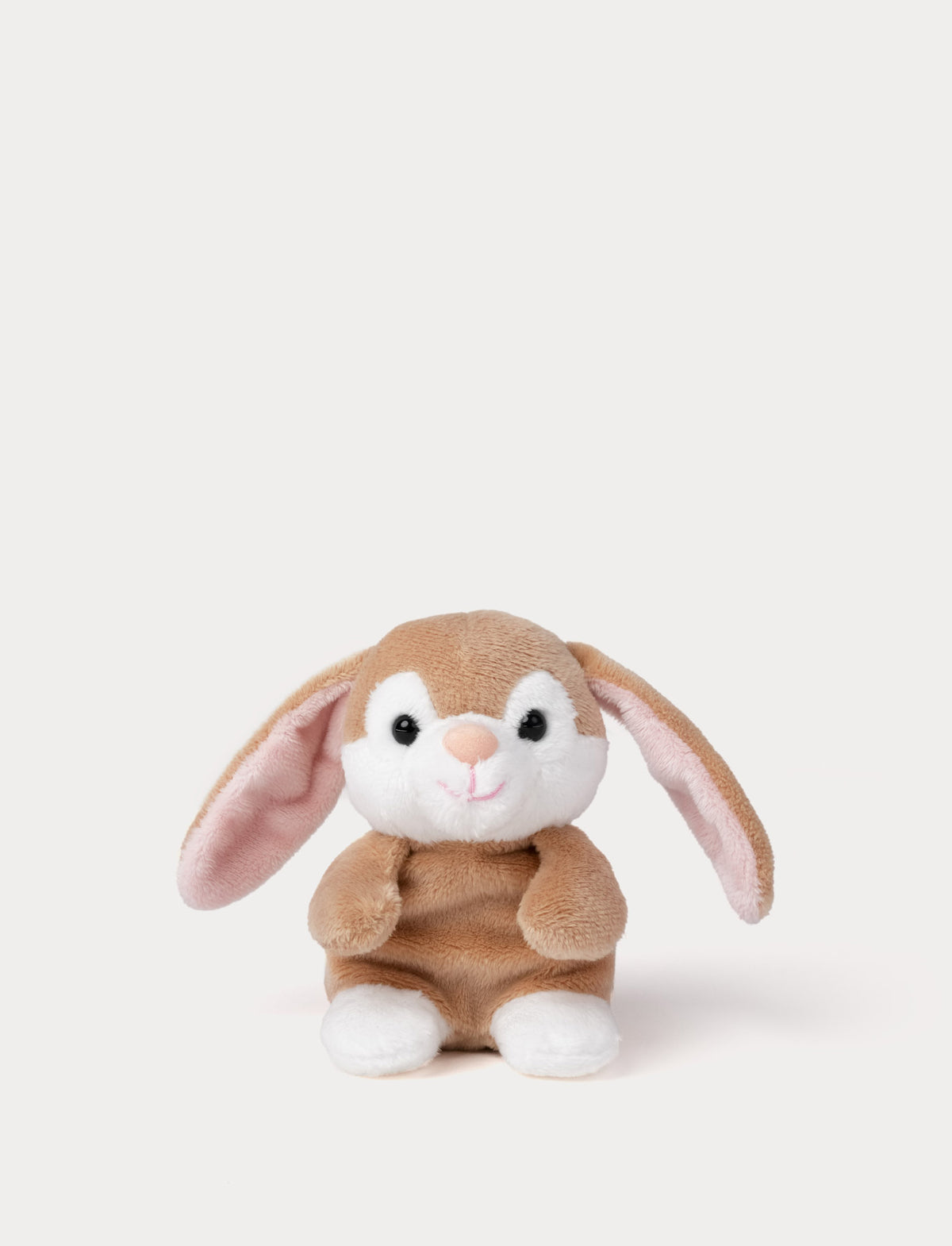  Image of Plush toy rabbit with brown fur and white paws on a light gray background