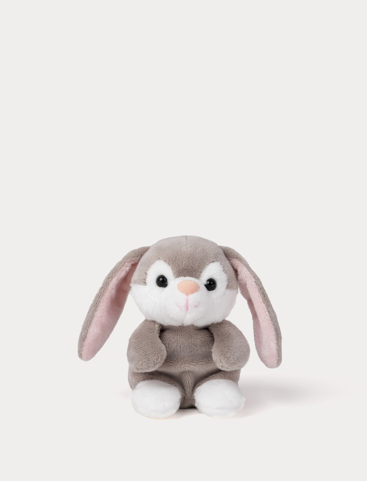  Image of Plush toy rabbit with a white face and pink ears on a light gray background
