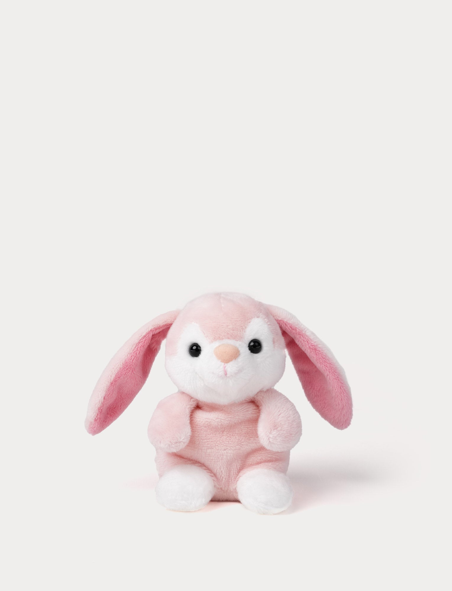  Image of Pink plush bunny toy on a white background