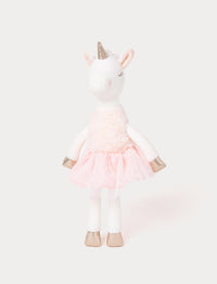 Soft white plush unicorn with a gold horn, pink skirt, and gold hooves. Featuring closed embroidered eyes.