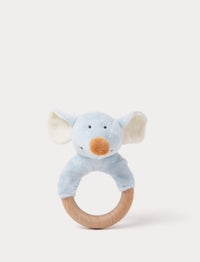 Baby teething ring with a wooden handle and a soft plush elephant head in light blue, featuring large ears and embroidered facial details.