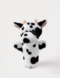 Soft black and white cow hand puppet with pink horns, floppy ears, and shiny black eyes.