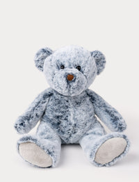 Soft, plush teddy bear with mottled blue fur, black button eyes, a brown nose, and beige paw pads.