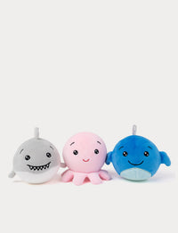 Three squishy plush toys shaped like a shark, octopus, and whale on a white background