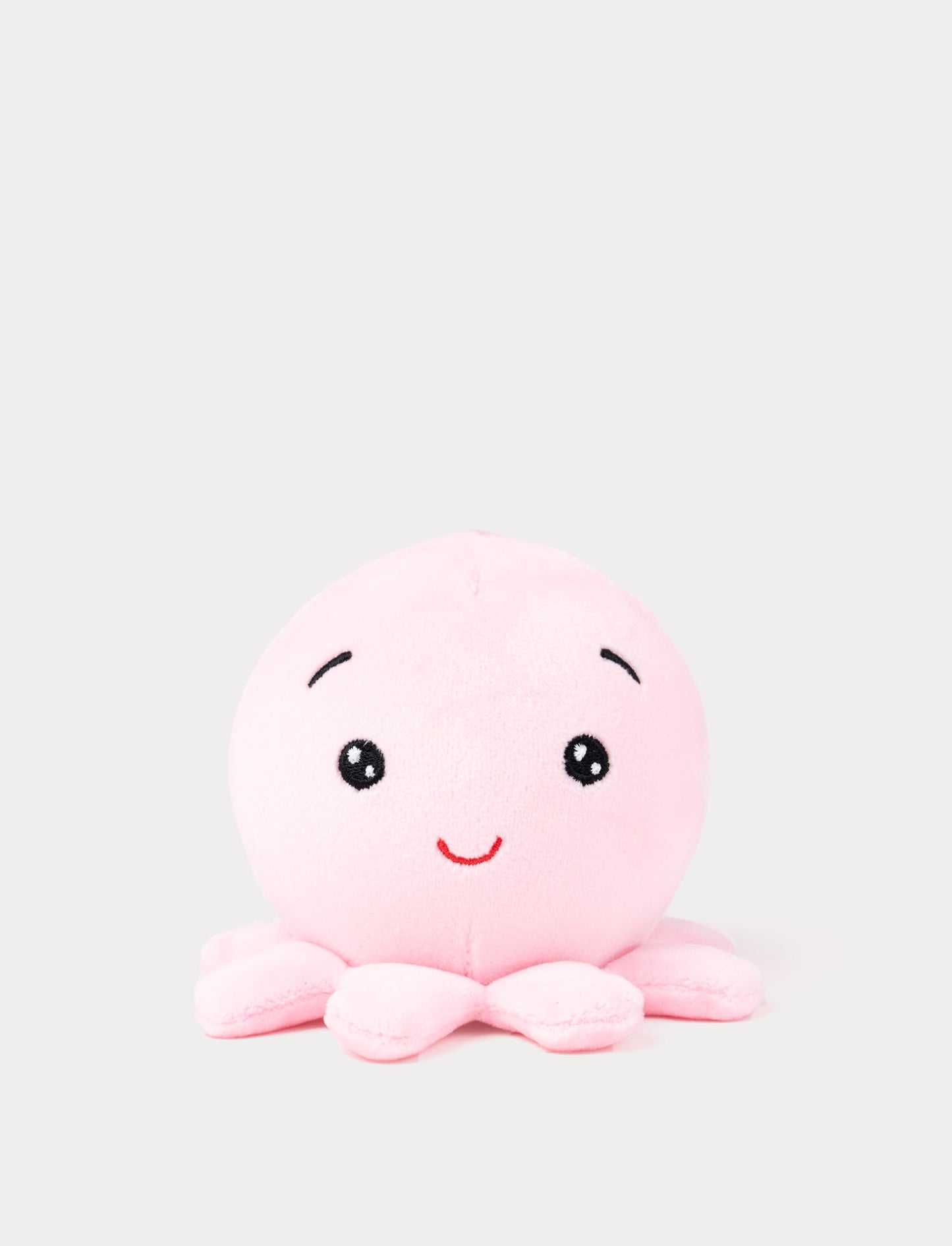 Soft pink octopus plush toy with a cute smiling face
