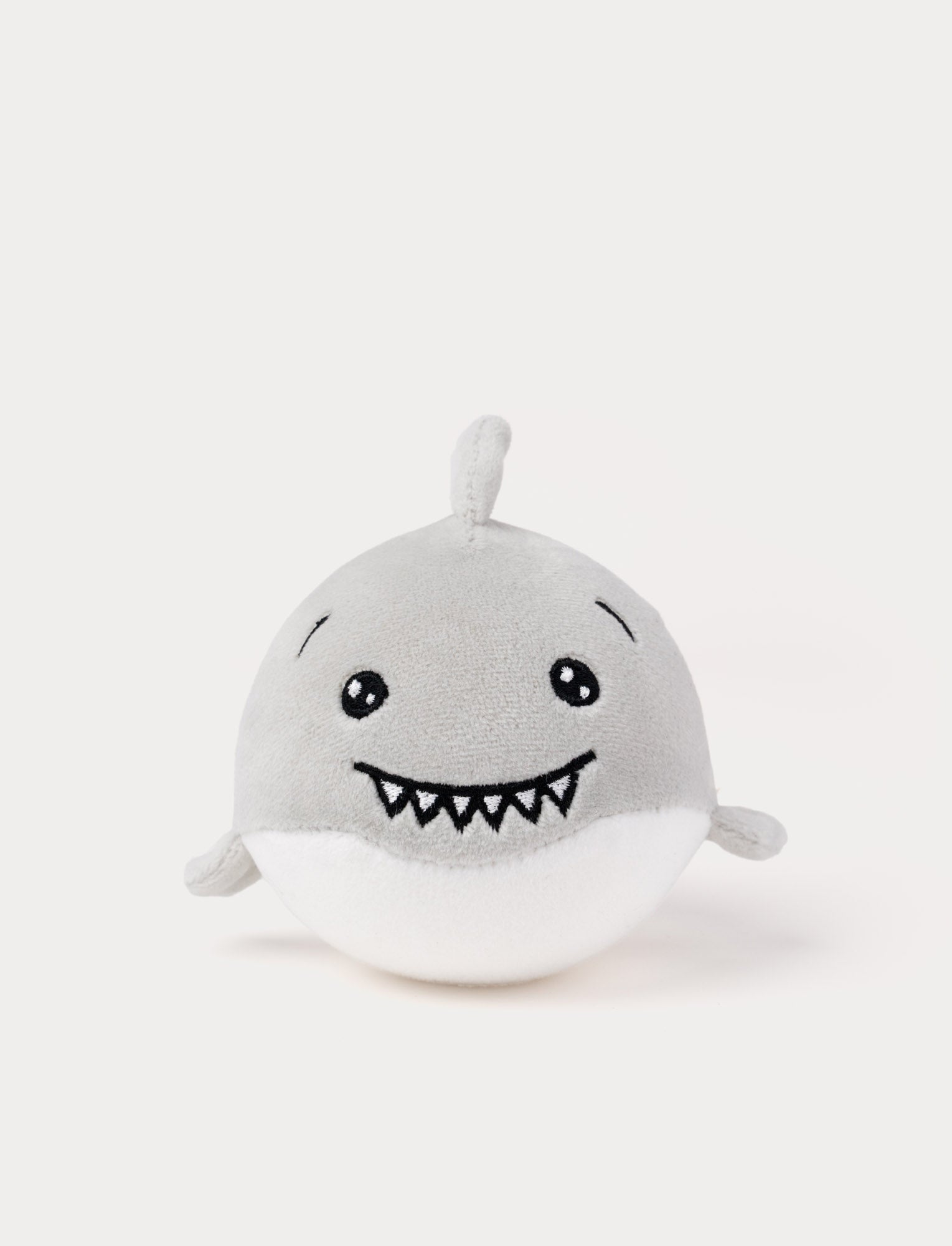 Image of Soft grey shark plush toy with a smiling face and small fins