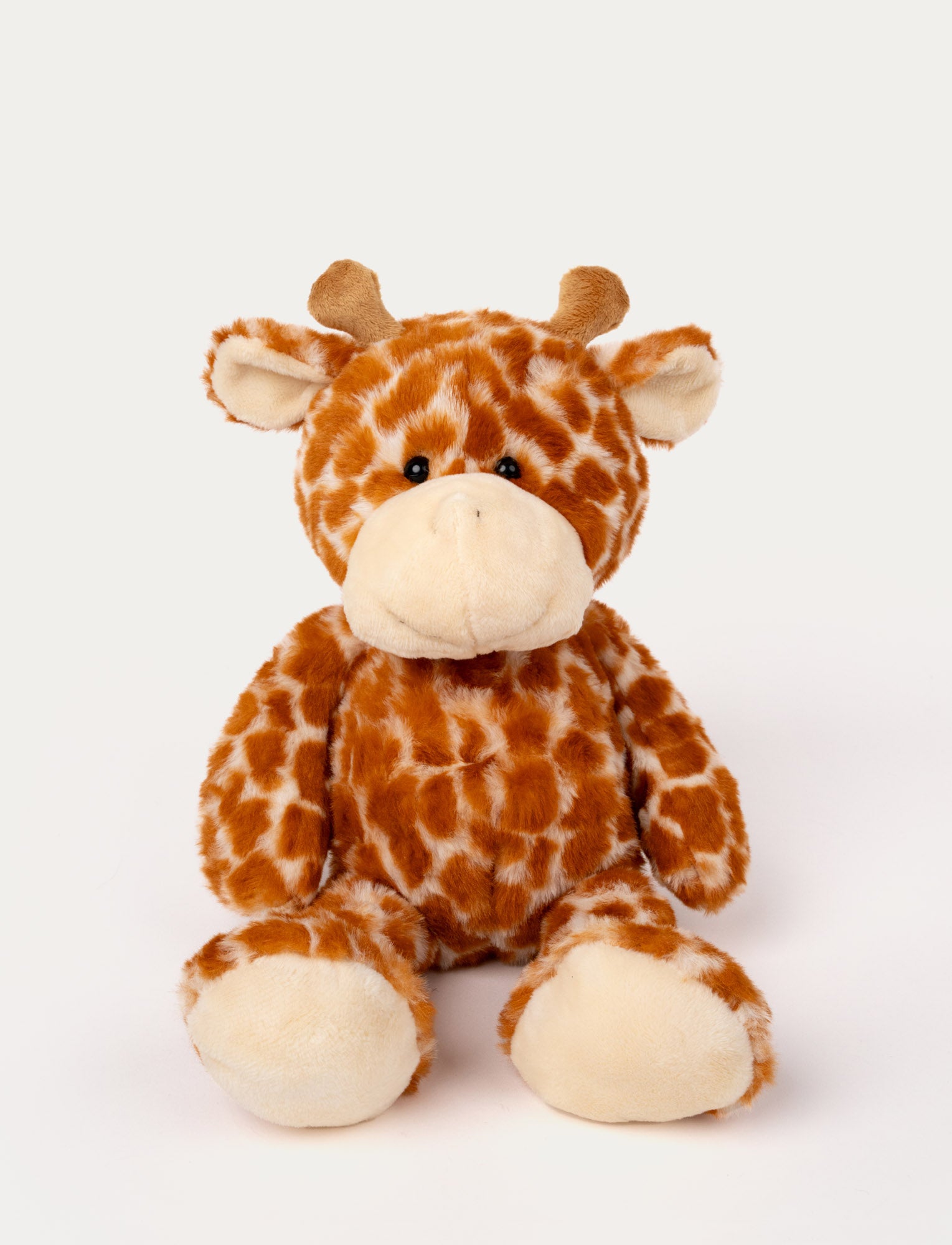  Image of Soft, plush giraffe with orange and white patterned fur, small horns, floppy ears, and beige paw pads.