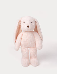 Soft, plush bunny with light pink fur, long floppy ears, black button eyes, and a small stitched nose.