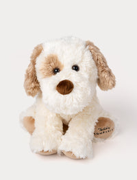 Soft, plush dog with fluffy white and light brown fur, black button eyes, a brown nose, and embroidered text on one paw.