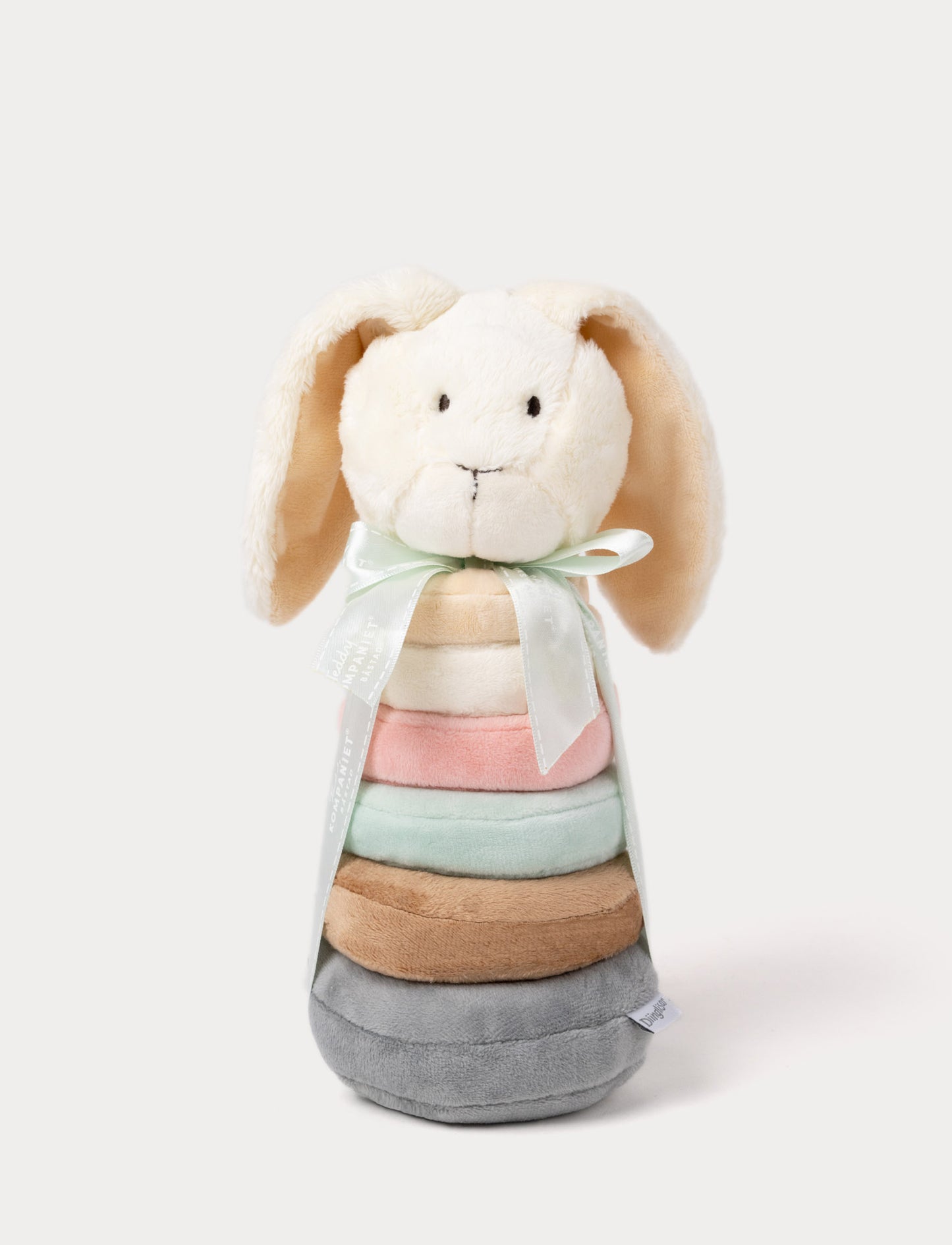 A plush bunny ring stacker toy with pastel-colored rings, floppy ears, and a decorative ribbon