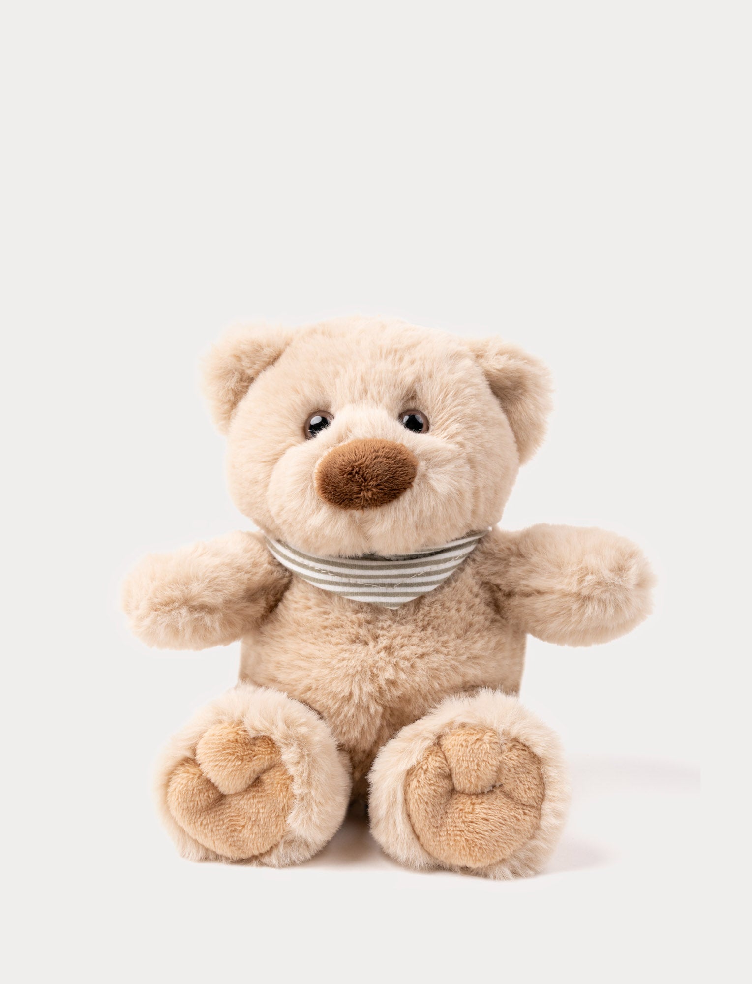  Image of A light beige teddy bear with an adorable scarf made of organic cotton.
