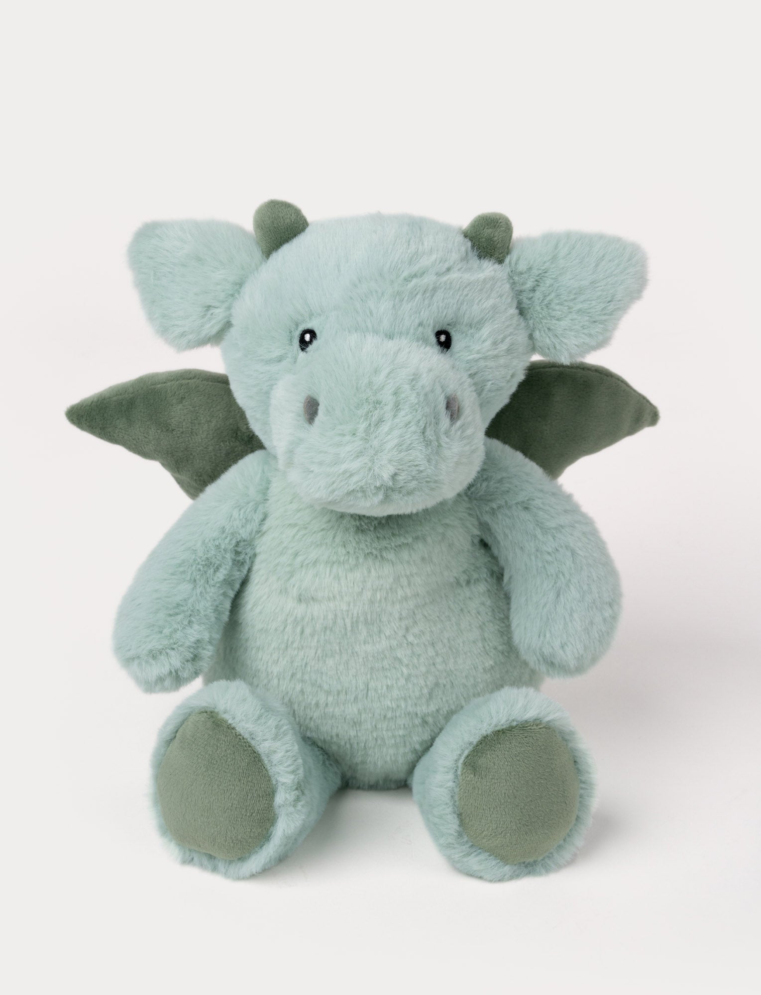  Image of Soft plush dragon with light green fur, dark green wings and horns, embroided eyes, and a round body.